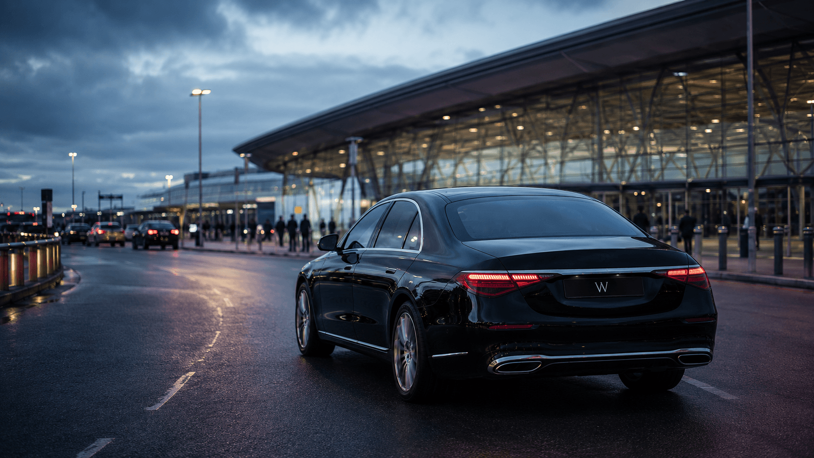 Weycross S-Class on the approach road to a Heathrow terminal at dusk